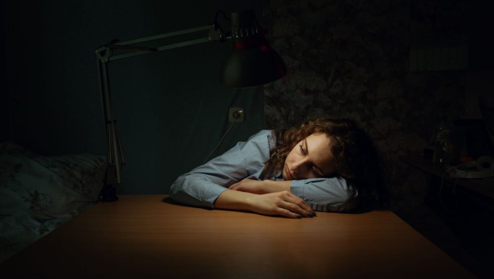 Woman resting in a dimly lit room