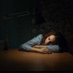 Woman resting in a dimly lit room