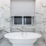 Marble bathroom interior with a freestanding bath