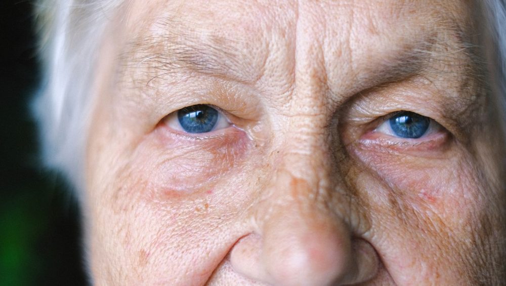Close-up portrait of an older woman with the eye area in focus