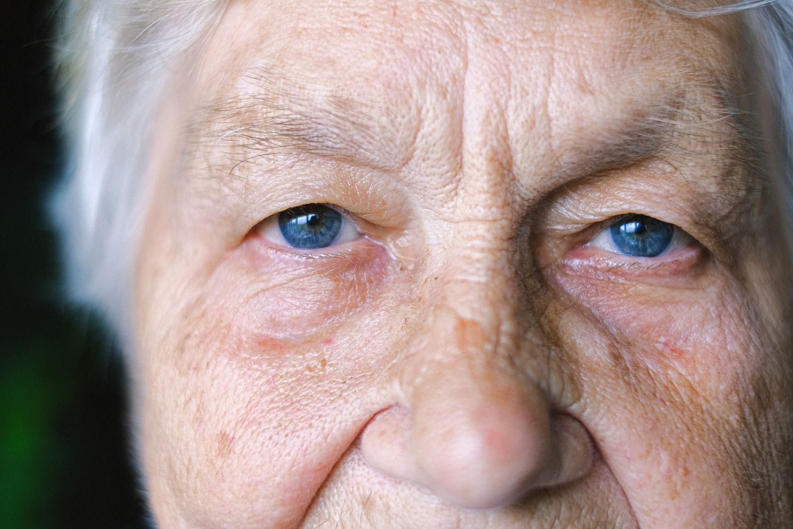 Close-up portrait of an older woman with the eye area in focus