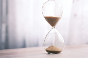 Sand running through an hourglass