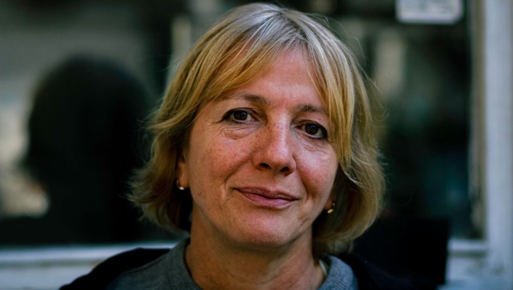 Mature woman with short blonde hair in natural light