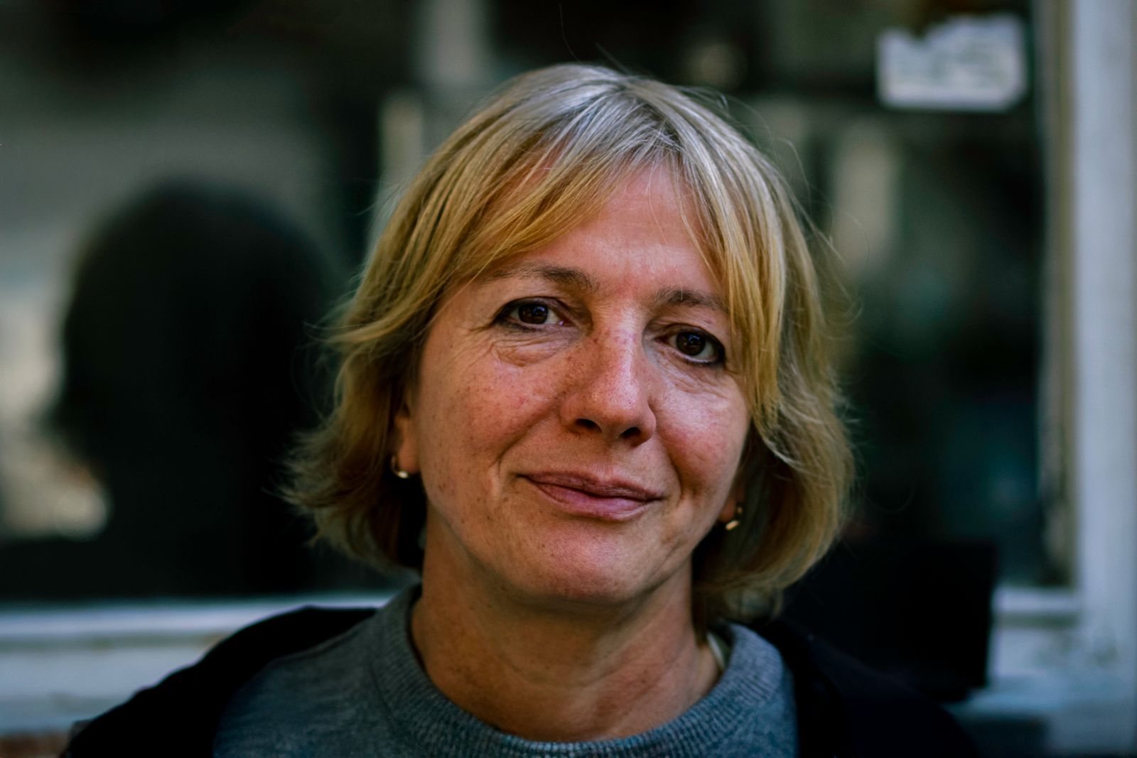 Mature woman with short blonde hair in natural light