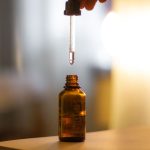 Two serum bottles side by side, one peptide and one retinoid