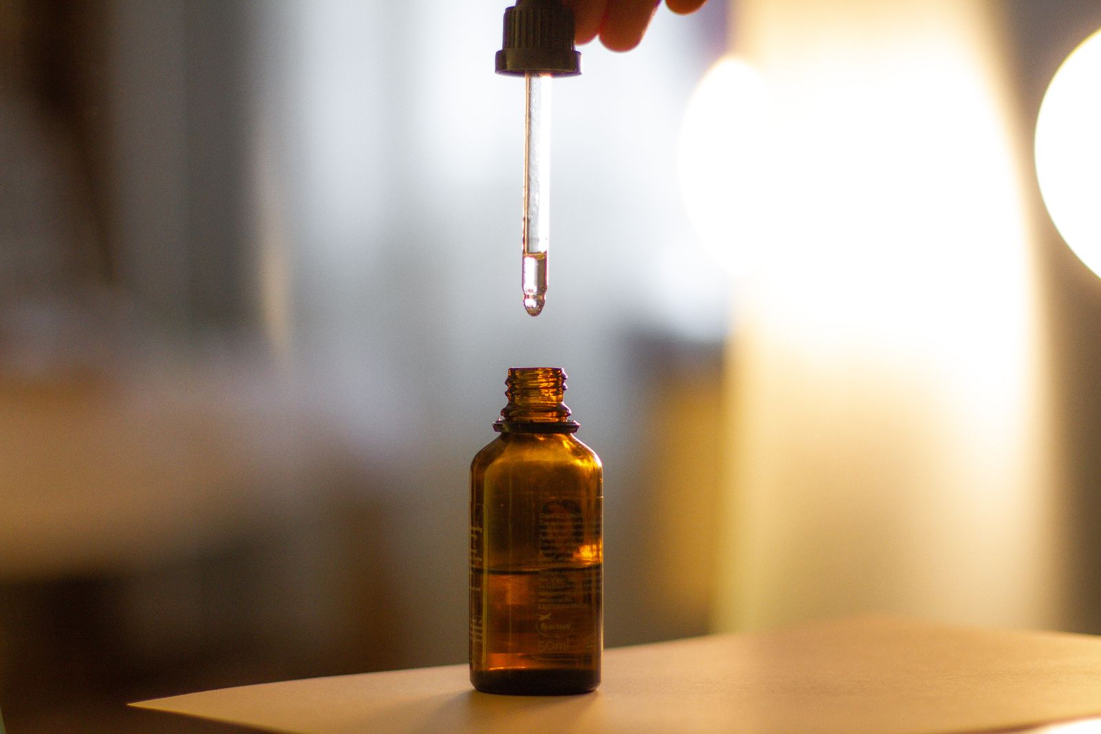 Two serum bottles side by side, one peptide and one retinoid