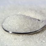 A spoonful of fine sugar crystals