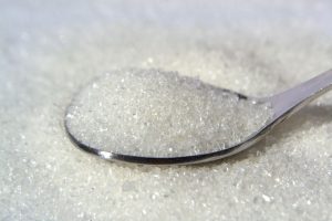 A spoonful of fine sugar crystals