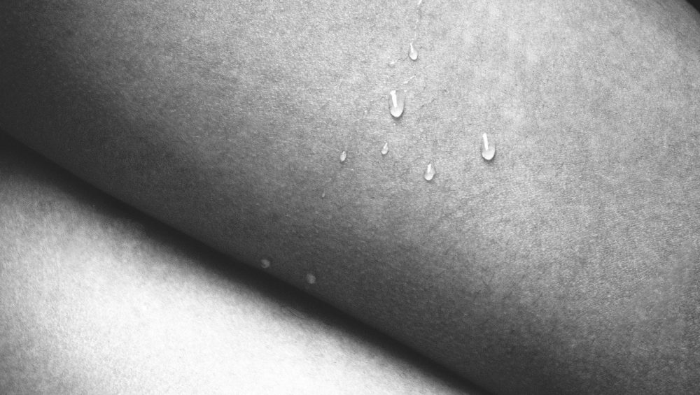 Water droplets resting on bare skin