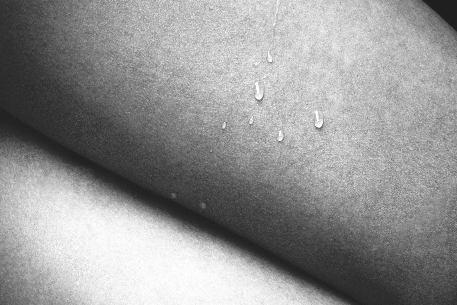 Water droplets resting on bare skin